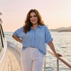 light blue Umgee button-down top with short sleeves and a frayed hem